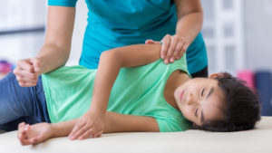 child with structural problems at chiropractor